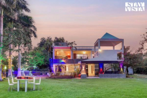 StayVista's Palm Perle Villa - Pet-Friendly Retreat with Terrace, Lawn & Pool Table